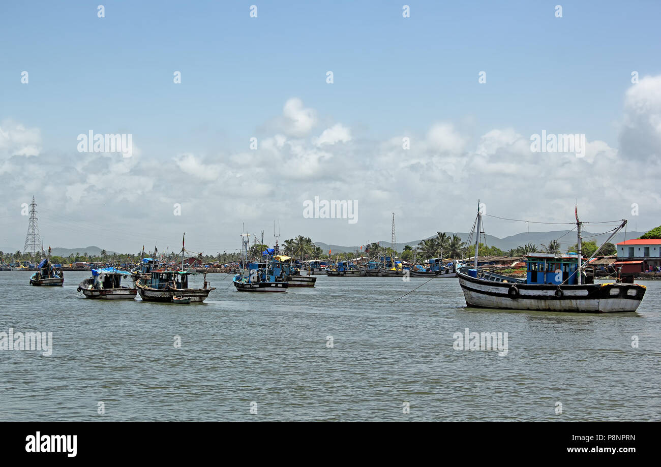 Anchored fishing boats at Cutbon Fishing Jetty, at the mouth of Sal River, adjacent to Cutbona Jetty in Goa, viewed from Betul. Stock Photo