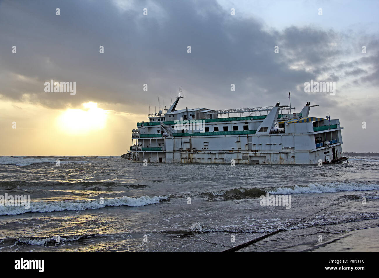 Marine vessel, to be used as offshore casino, run aground off Miramer coast in Goa, India, waiting to be salvaged. Stock Photo