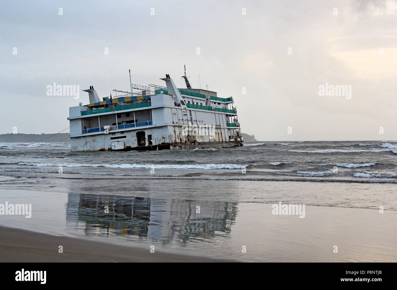 Marine vessel, an offshore casino, that run aground near Miramer beach in Goa, India, waiting for rescue. Stock Photo