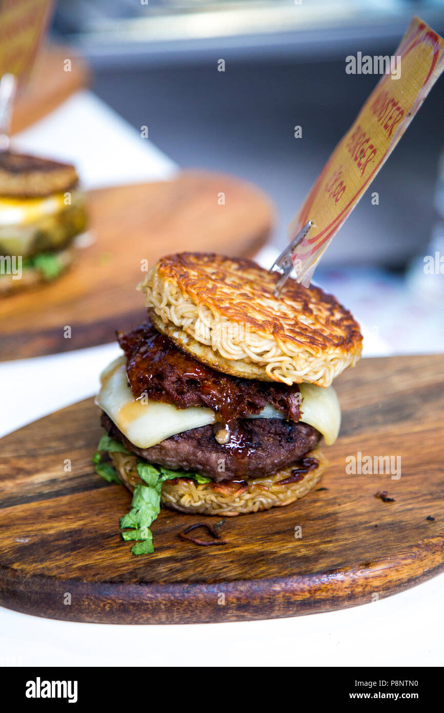 Ramen burger at a food stall in the Greenwich Market, London, UK Stock Photo