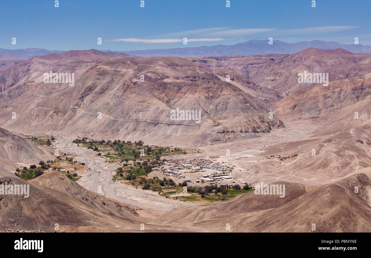 The village Pachica in a deep canyon in the desolate Atacama desert Stock Photo
