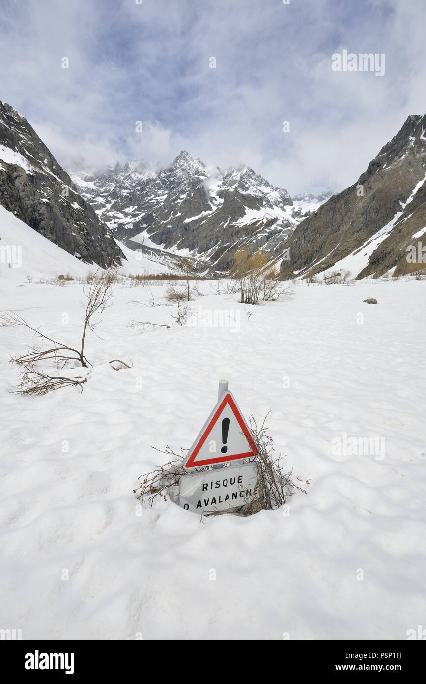 Risk of avalanches in a snow covered landscape of National Park the Ecrins during spring when the snow is melting Stock Photo