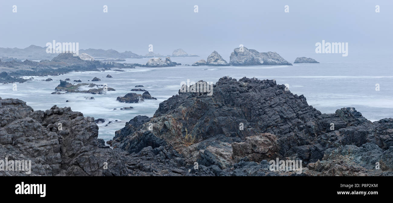 Rocky coast of northern Chile in hazy weather Stock Photo