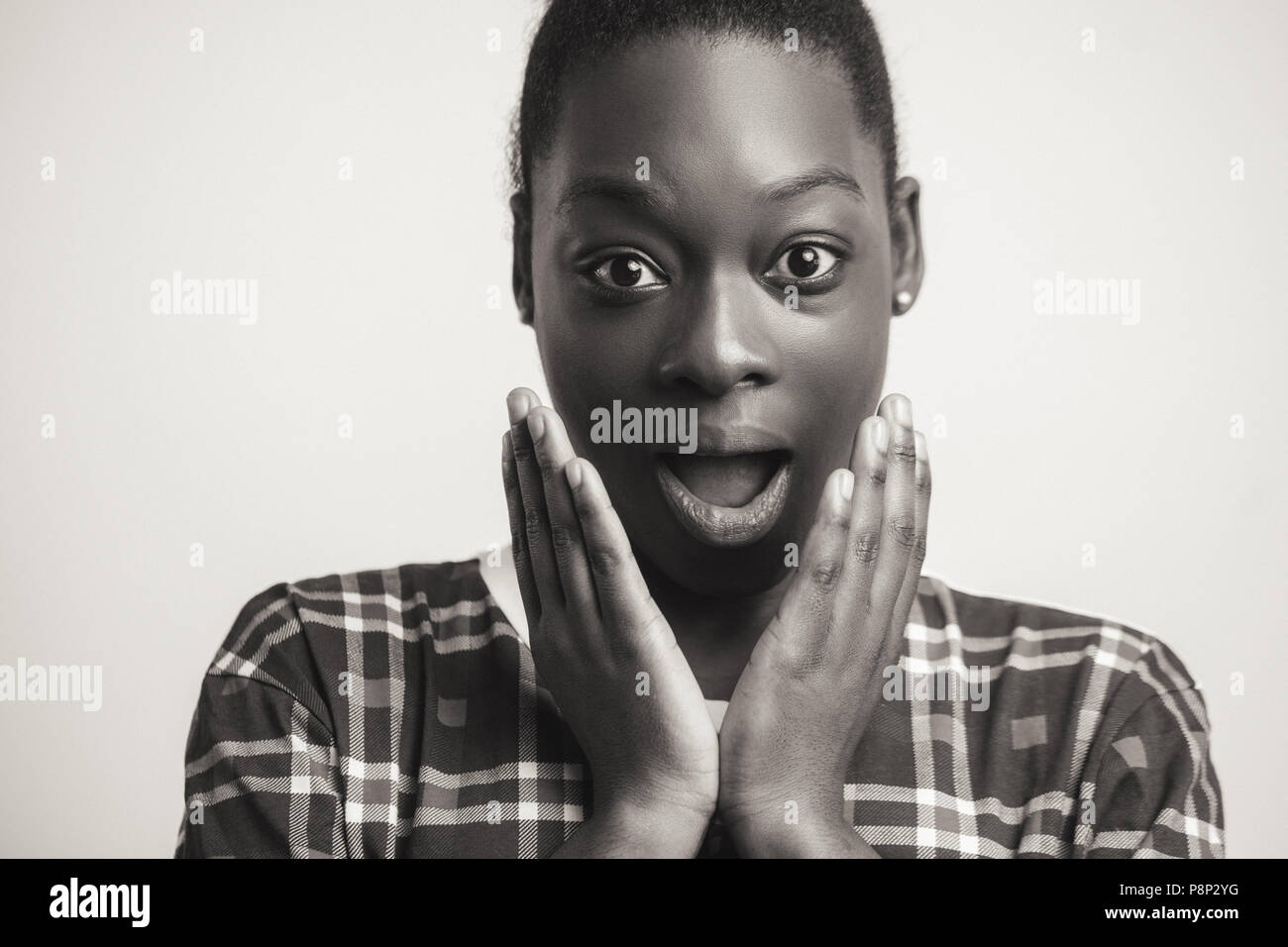 African woman with puzzled expression. white and black photo. black female face with great