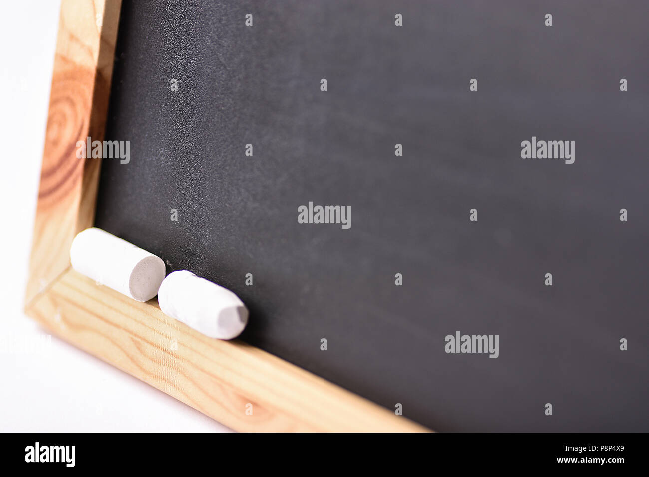 Blurred Empty Mock Up Black Chalkboard with White Chalks. Back to School Concept Education Learning. Creative Image with Copy Space. Poster Banner Tem Stock Photo