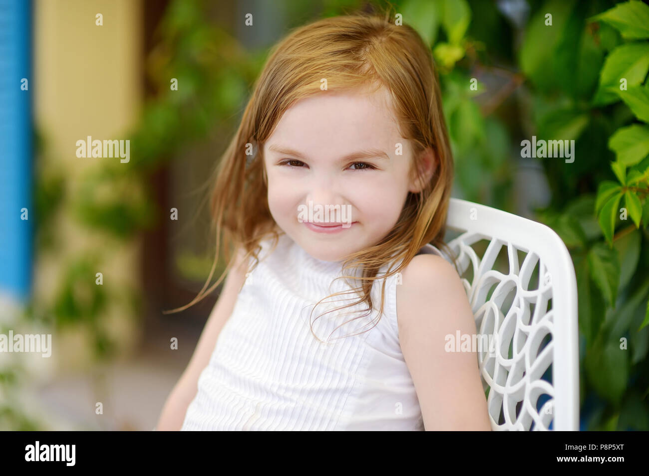 Portrait of adorable little girl outdoors Stock Photo - Alamy