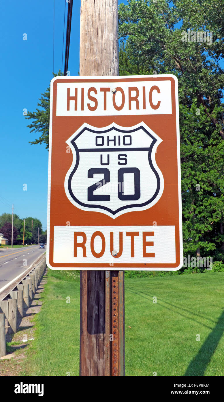 A road sign marks the historic route, Ohio US 20, as one passes through Perry, Ohio, USA. Stock Photo