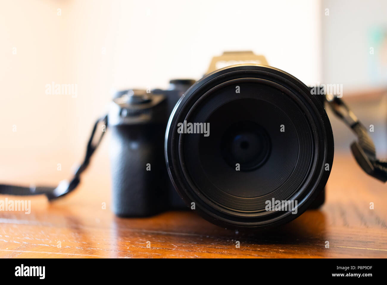 Digital mirrorless Camera with zoom Lens on a table Stock Photo Alamy