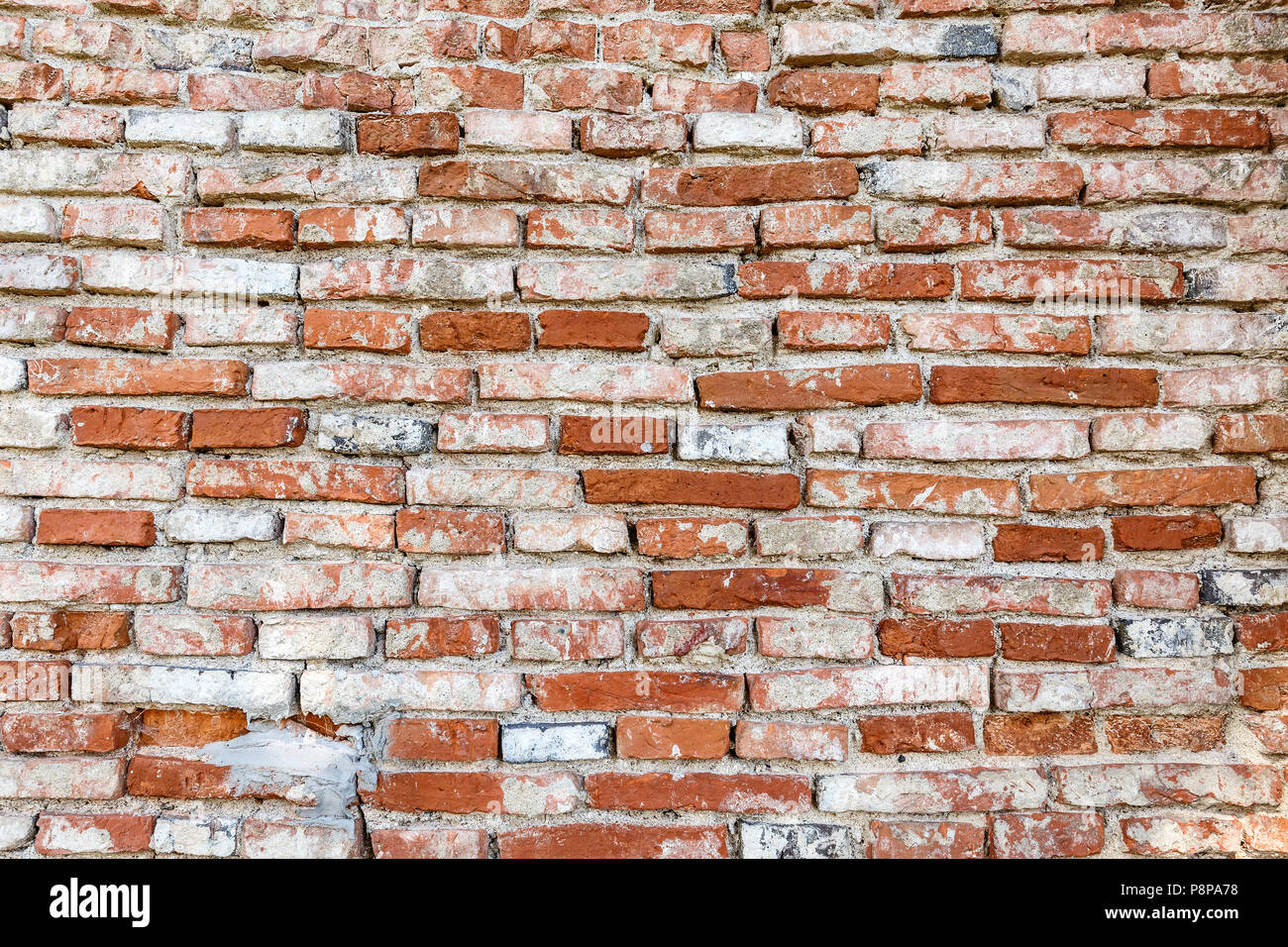 Weathered brick wall surface as a background Stock Photo - Alamy