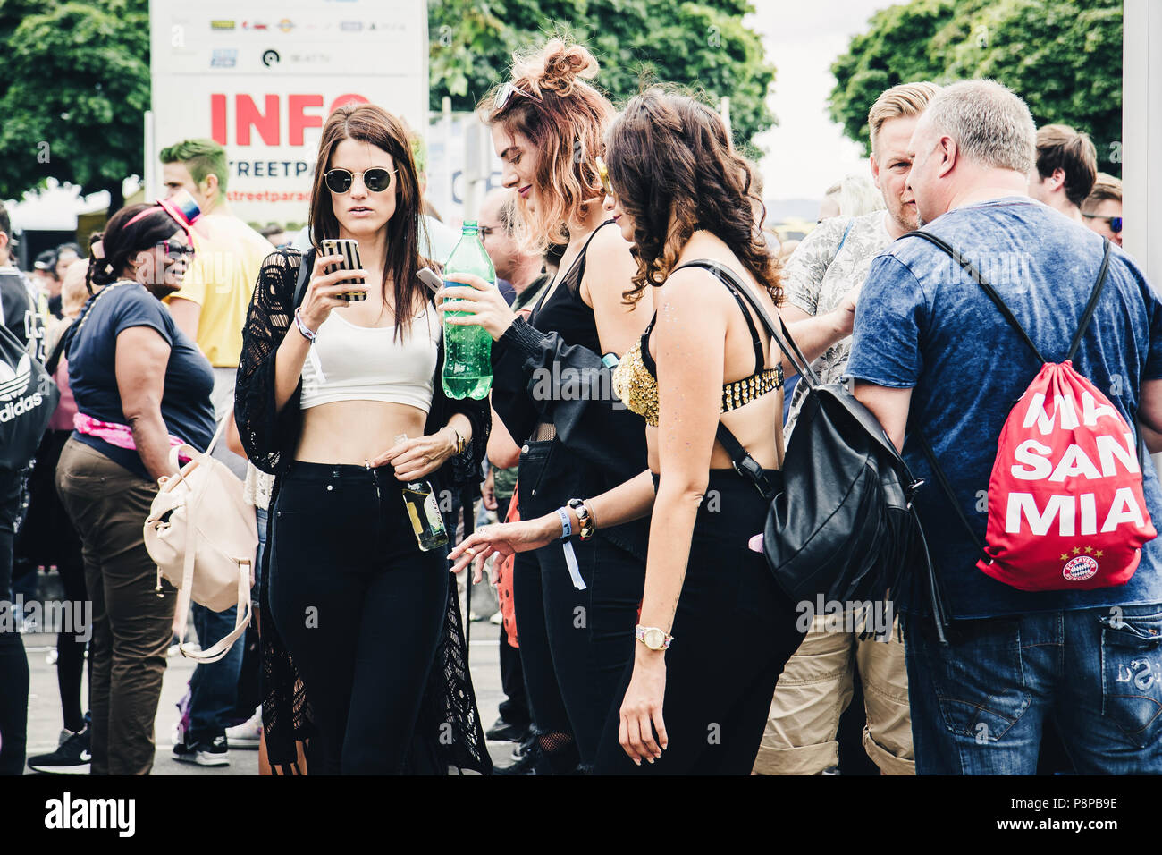 Zurich, Switzerland - August 12, 2017: People of all ages on the Street  Parade in Zürich. Young women using smartphones, older men talking to each  oth Stock Photo - Alamy
