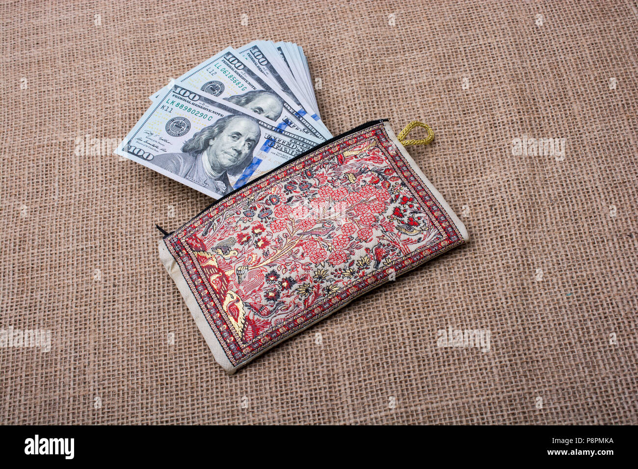 Banknote of US dollar in a purse on a linen canvas Stock Photo - Alamy
