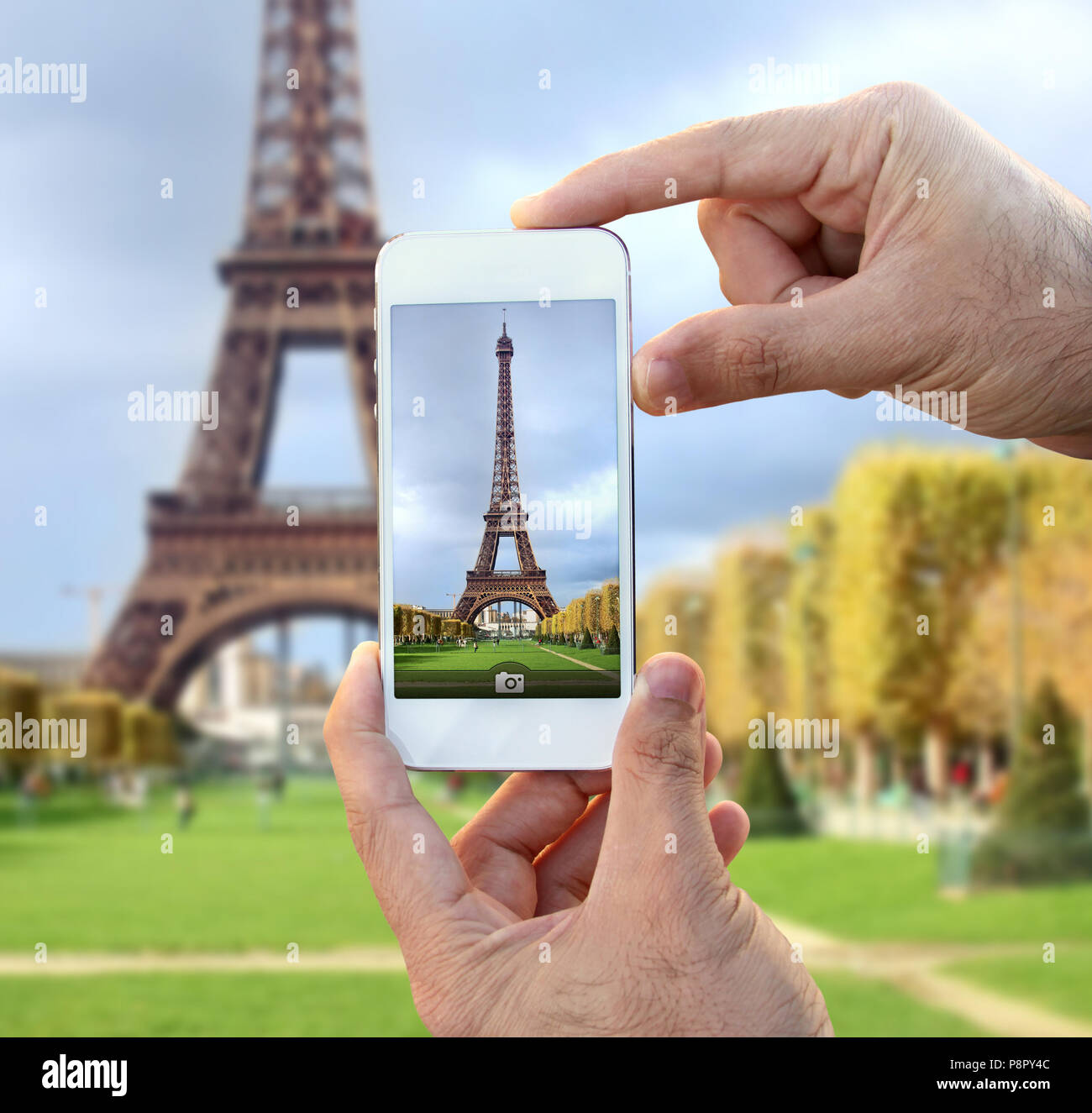 picture of eiffel tower in the phone camera with eiffel tower in the background Stock Photo