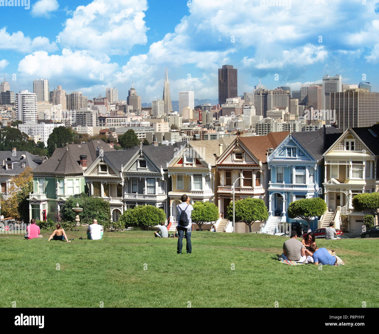 View from Alamo square San Francisco, victorian houses known as painted ladies with backdrop of San Francisco downtown Stock Photo