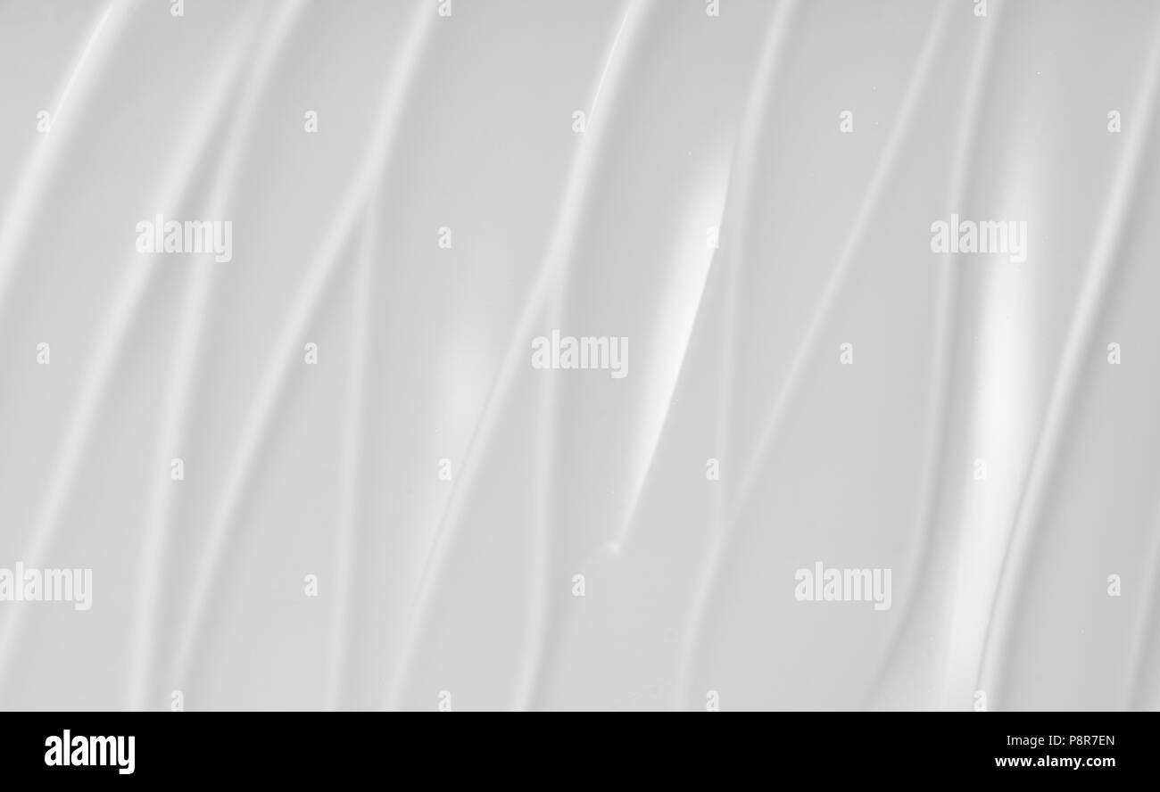 Texture of white cosmetic cream background. Creamy foundation texture