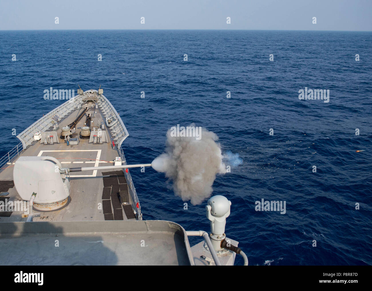 180711-N-YR245-0051 PACIFIC OCEAN (July 11, 2018) Guided-missile cruiser USS Lake Champlain (CG 57) fires its MK45 5-inch gun at a live-fire exercise with Chilean frigate CNS Almirante Lynch (FF 07) and Indian frigate INS Sahyadri (F49) during Rim of the Pacific (RIMPAC) exercise 2018. Twenty-five nations, 46 ships, five submarines, about 200 aircraft, and 25,000 personnel are participating in RIMPAC from June 27 to Aug. 2 in and around the Hawaiian Islands and Southern California. The world’s largest international maritime exercise, RIMPAC provides a unique training opportunity while fosterin Stock Photo