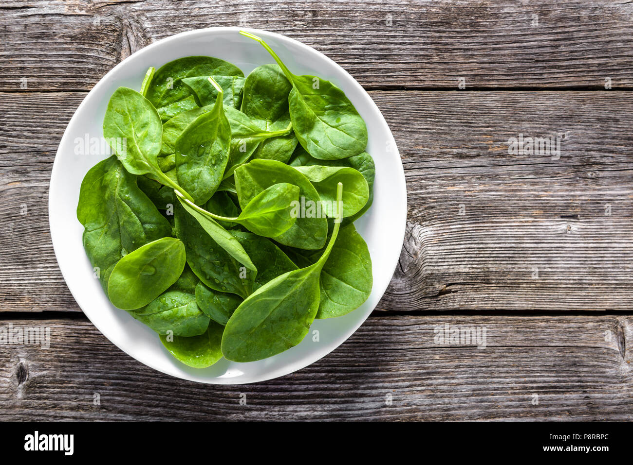Fresh vegetables, green spinach on plate, vegetarian food and healthy ...