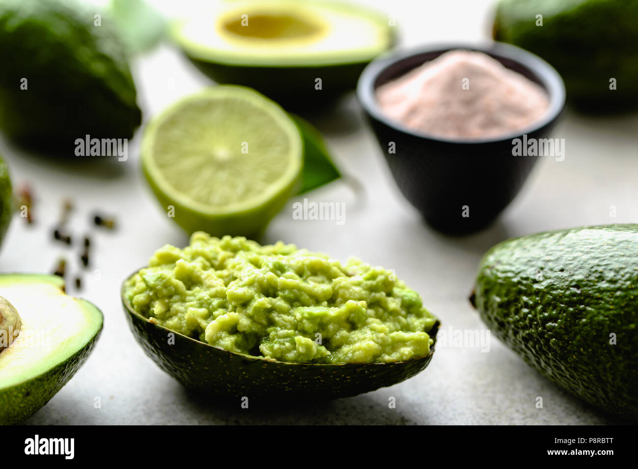 Traditional guacamole dip in avocado peel, healthy food for party
