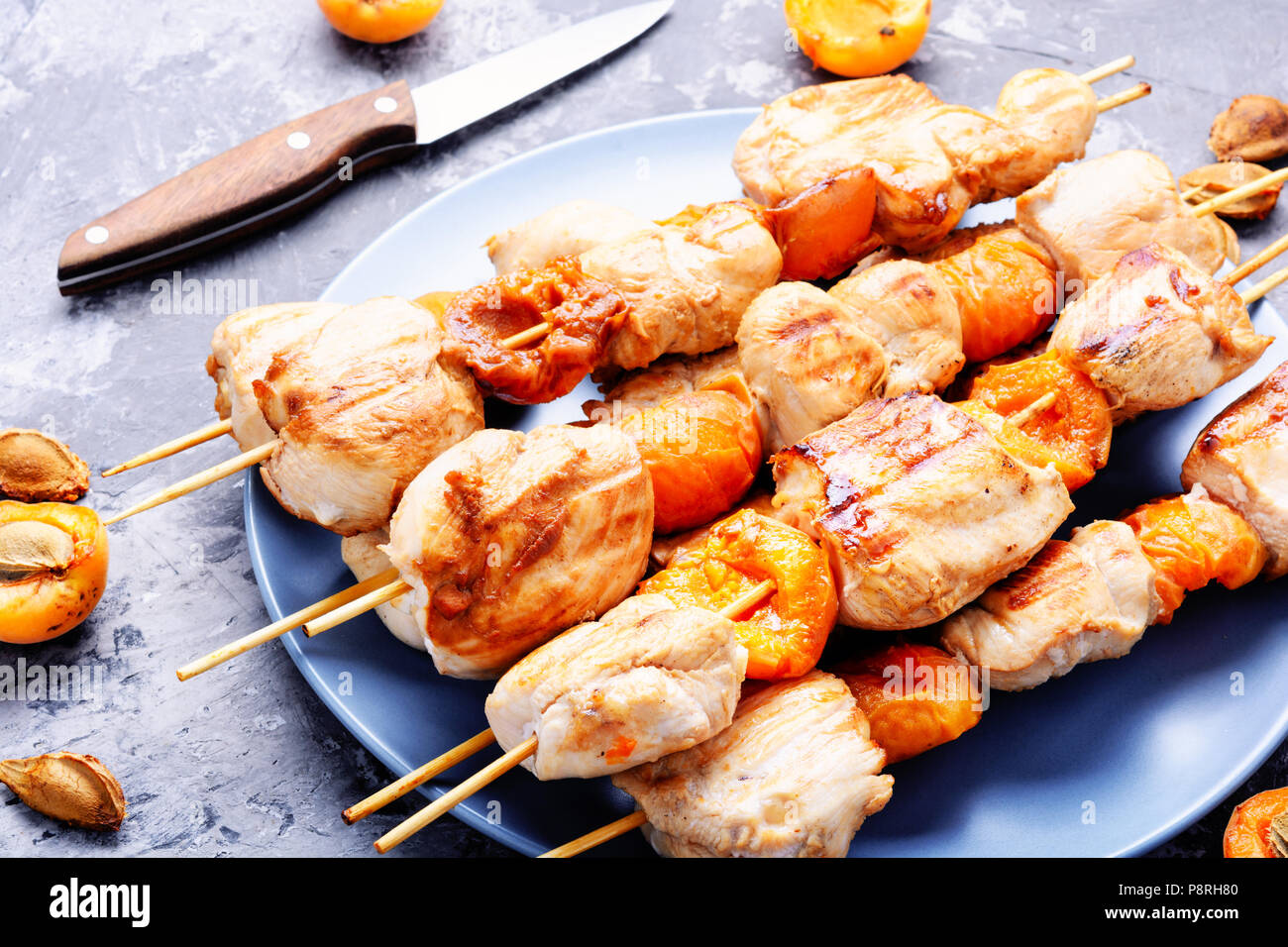 Turkey meat on barbecue grill,cooked on skewers with apricot .BBQFood