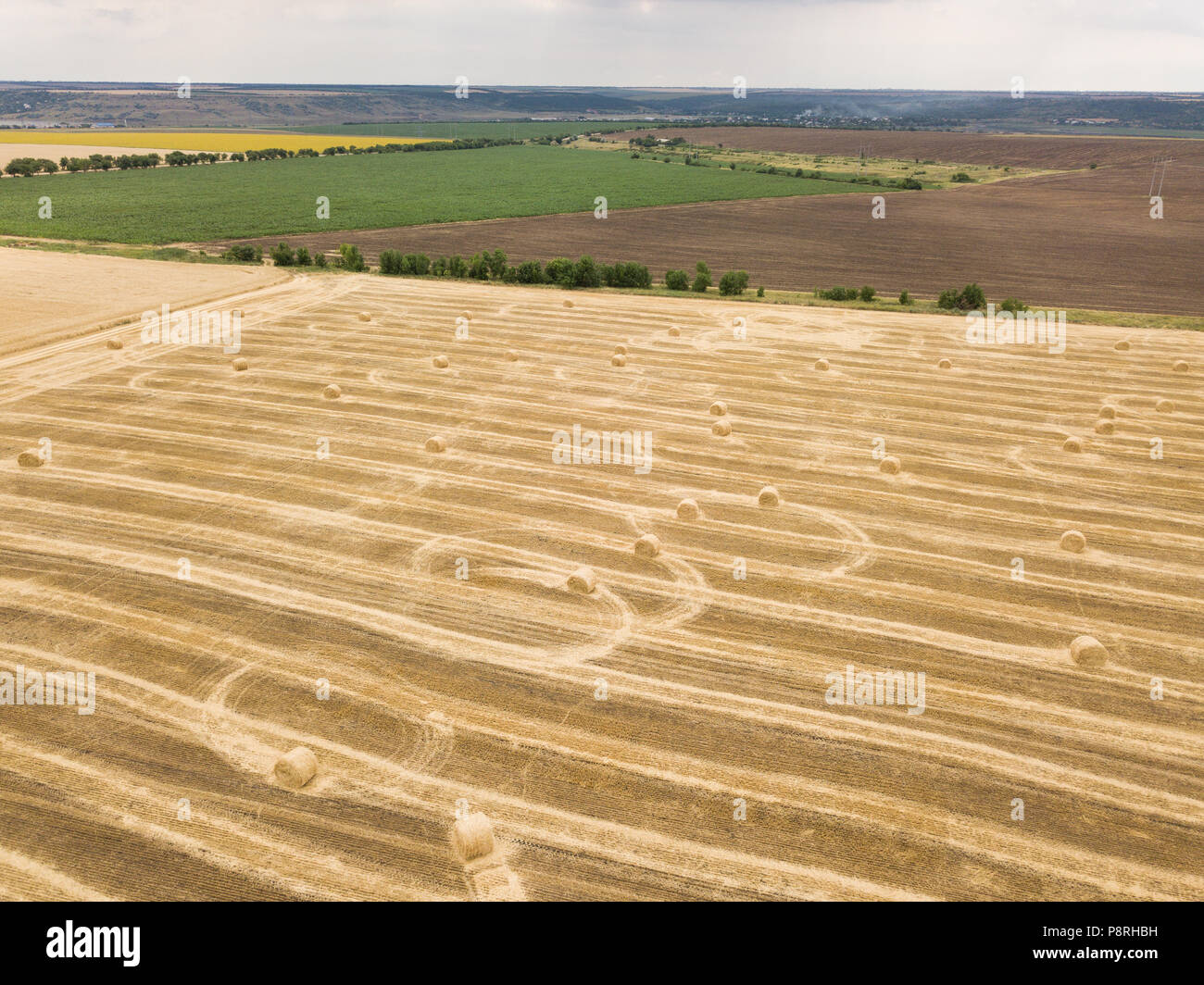 aerial top view to harvested field with straw bales in summer Stock ...