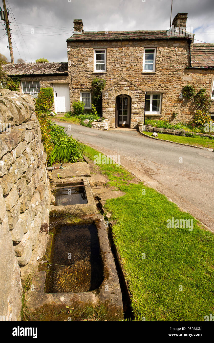UK, England, Yorkshire, Swaledale, Healaugh, spring-fed water troughs in middle of village Stock Photo