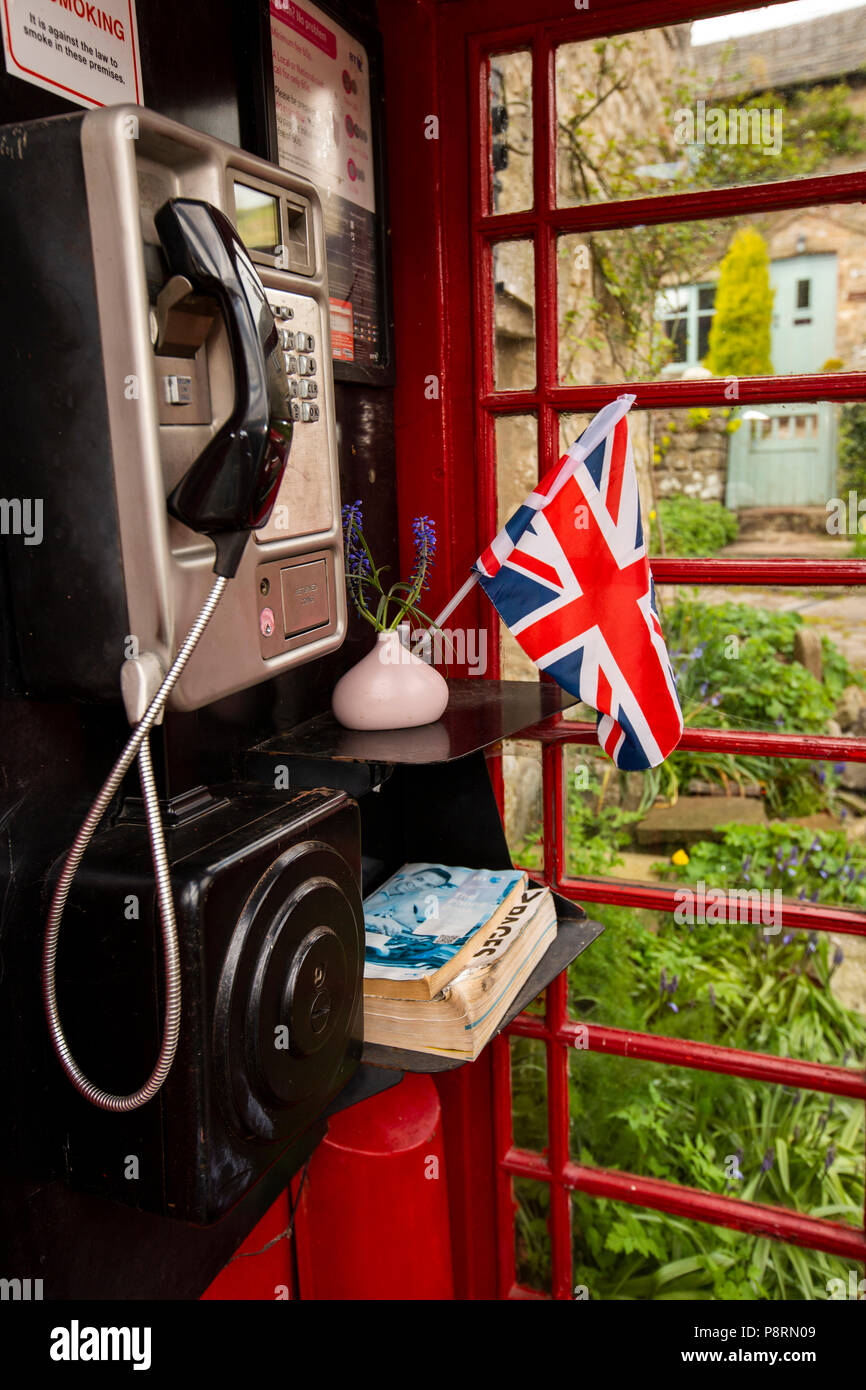 UK, England, Yorkshire, Swaledale, Healaugh, interior of well-kept village K6 red phone box Stock Photo