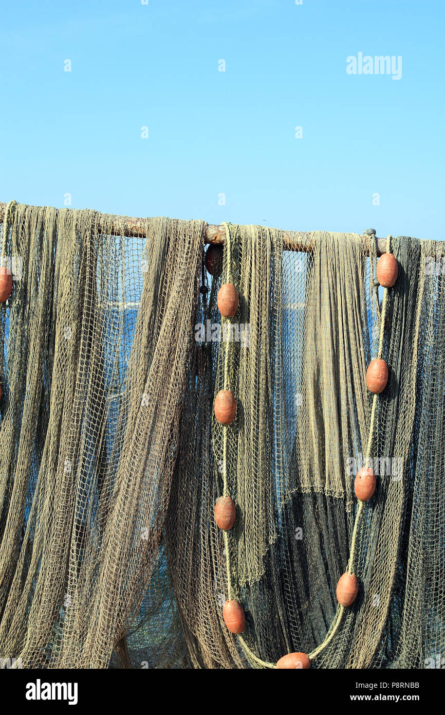 Drying the sun fishing nets in the pond edge of Thau, Pointe Courte in ...