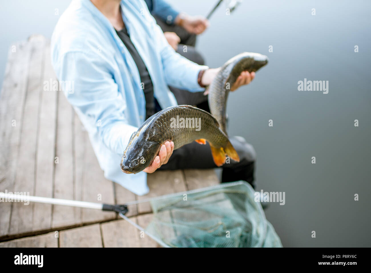 Two fish caught by fisherman hi-res stock photography and images - Alamy