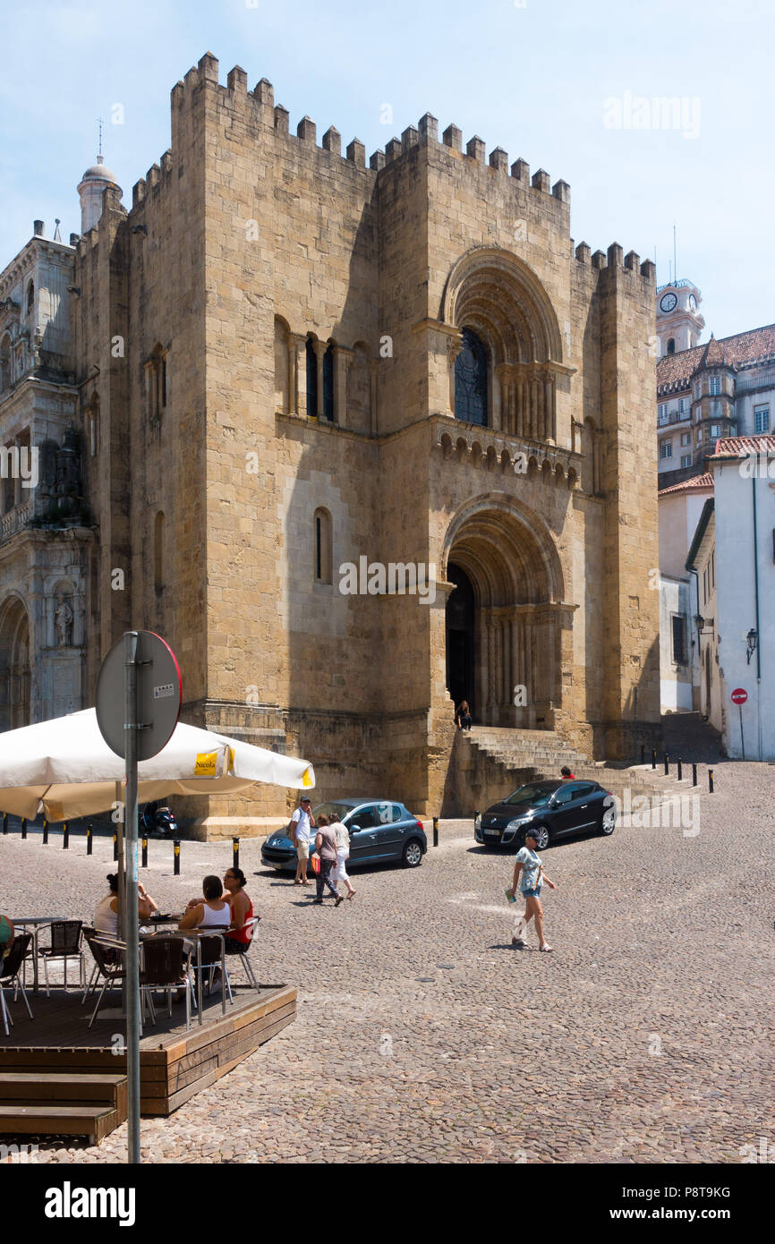 The main, fortress-like, entrance to the old Romanesque Cathedral (13th century), in Coimbra, Portugal Stock Photo