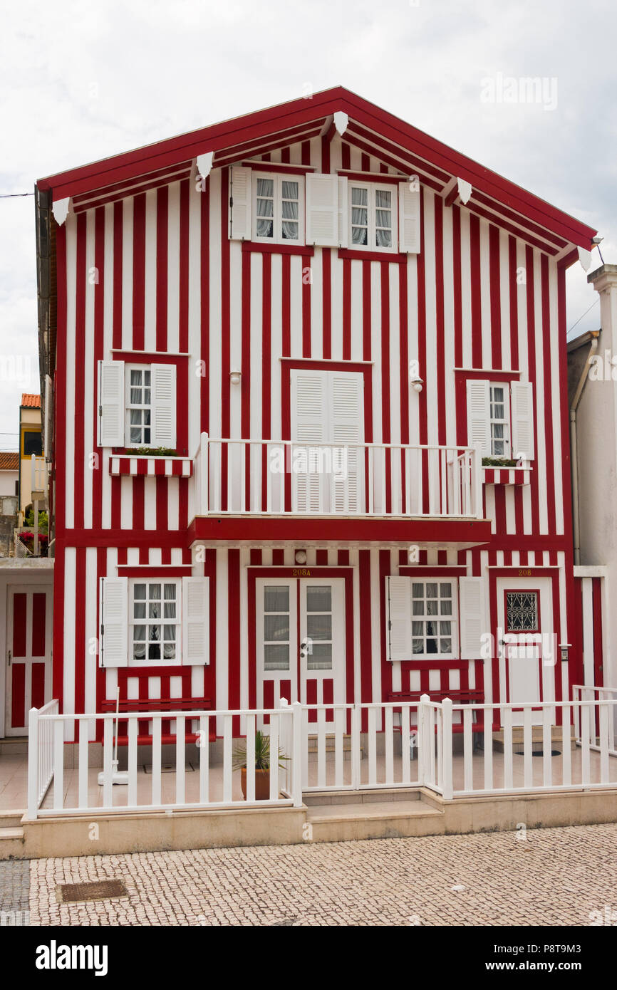 Colourful striped house at Costa Nova one of the beach areas near Aveiro, Portugal Stock Photo