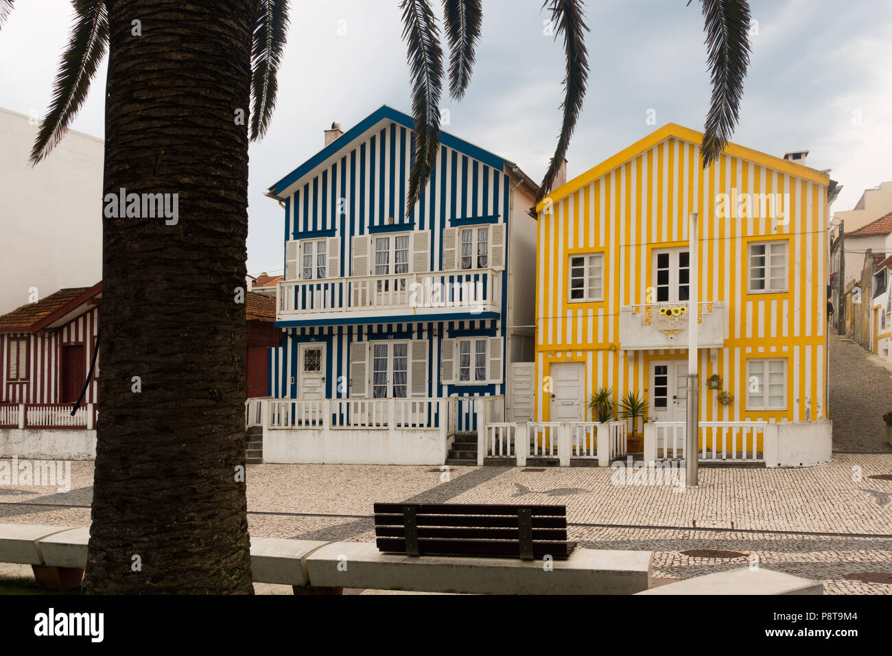 Colourful striped houses at Costa Nova one of the beach areas near Aveiro, Portugal Stock Photo