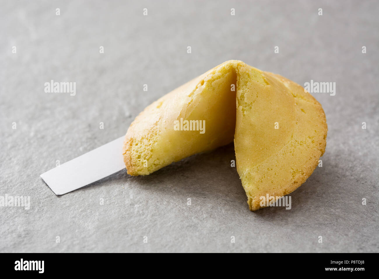 Fortune cookie on gray stone background Stock Photo