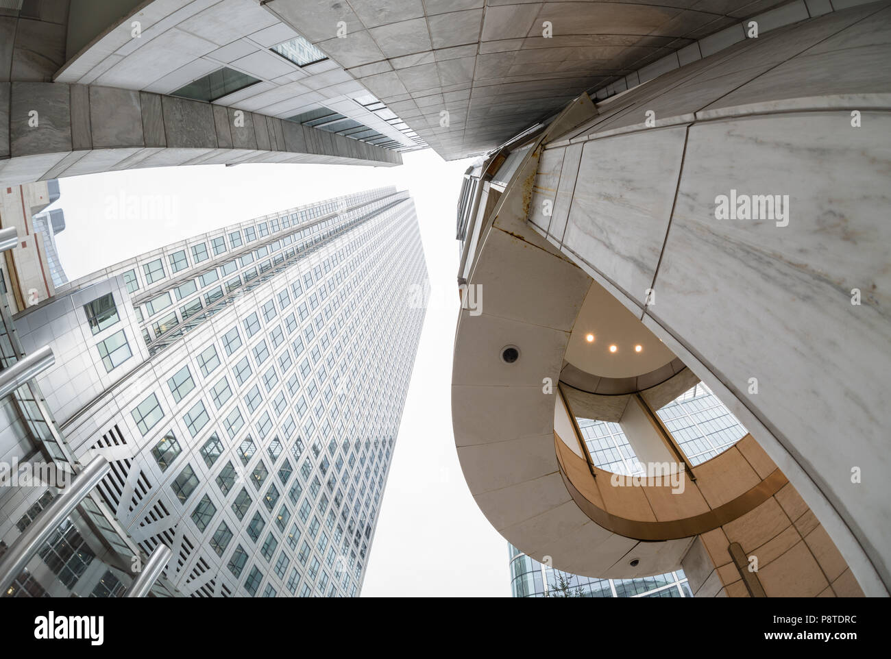 Wide angle perspective looking up at buildings on Canada Square, Canary Wharf, London Stock Photo