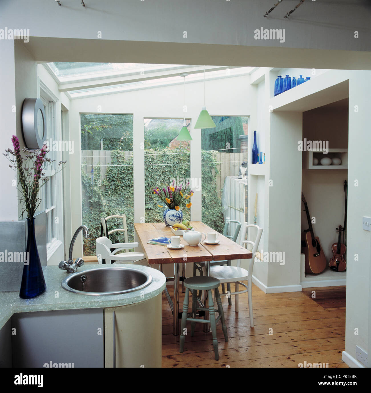 Mixer Tap And Stainless Steel Circular Basin In Curved Unit In Modern Kitchen And Dining Room Extension Stock Photo Alamy