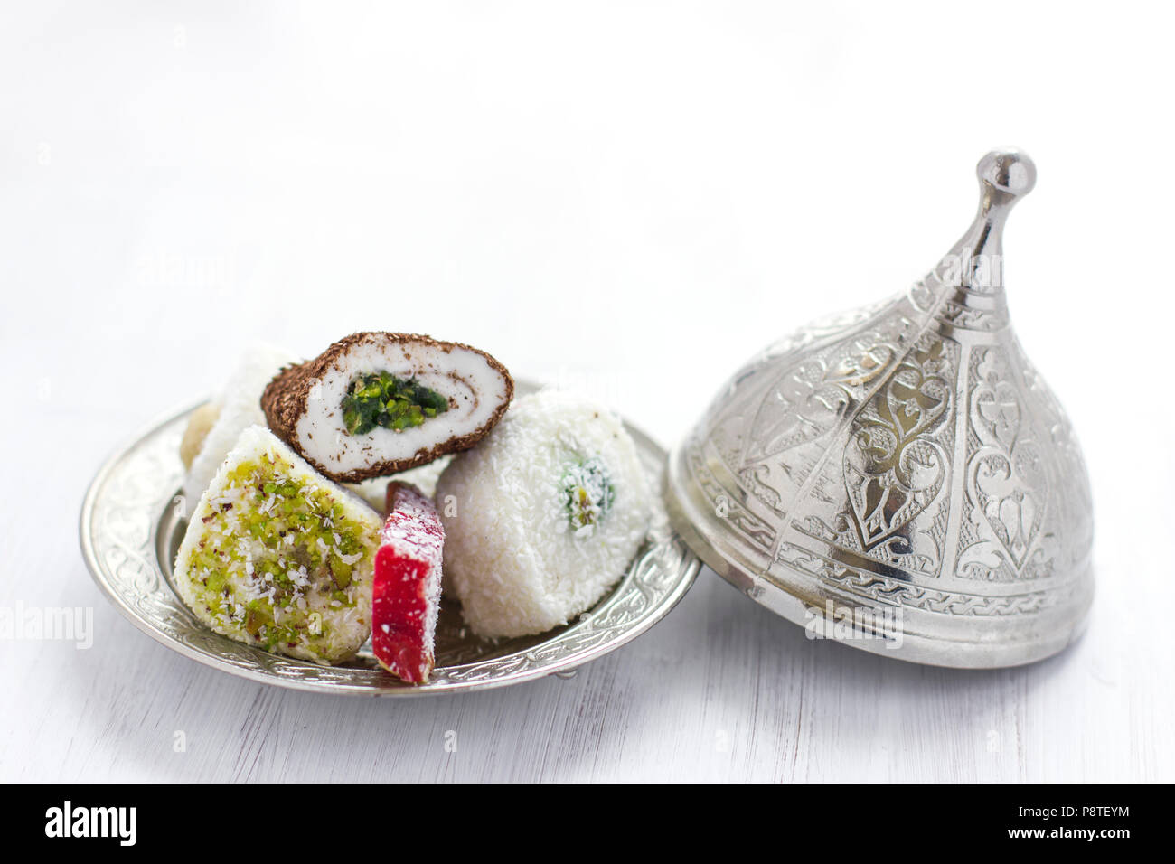 Traditional Turkish sweets lukum on silver saucer with lid Stock Photo
