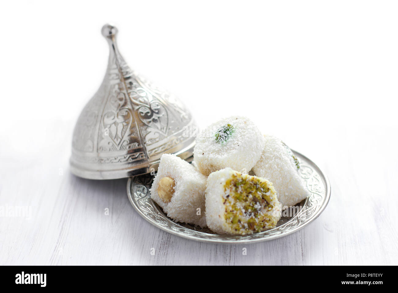 Traditional Turkish sweets lukum on silver saucer with lid Stock Photo