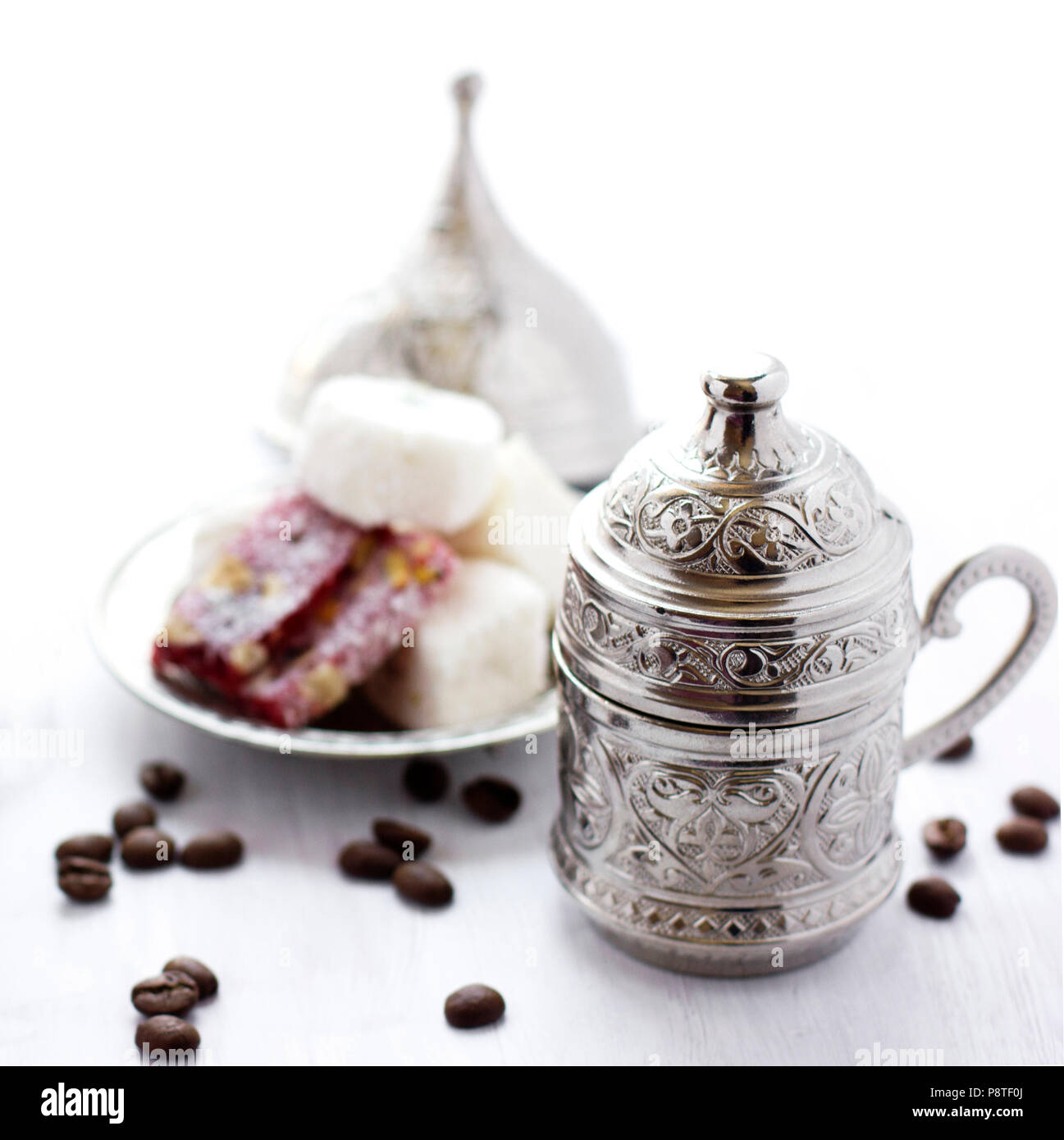 Turkish coffee with traditional turkish sweets in a silver mug Stock Photo