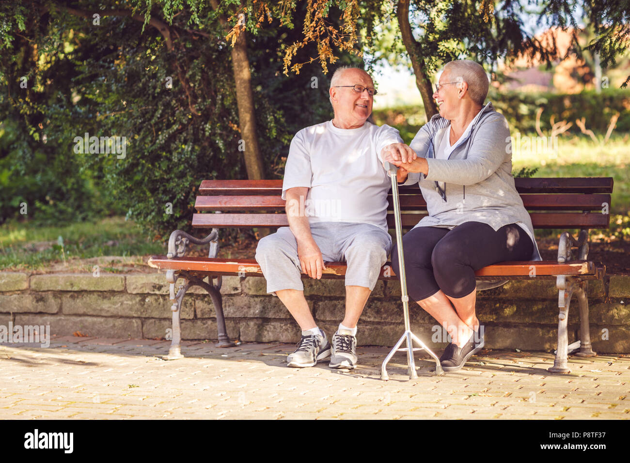 Senior  couple in the park smiling while feeling happy together concept Stock Photo