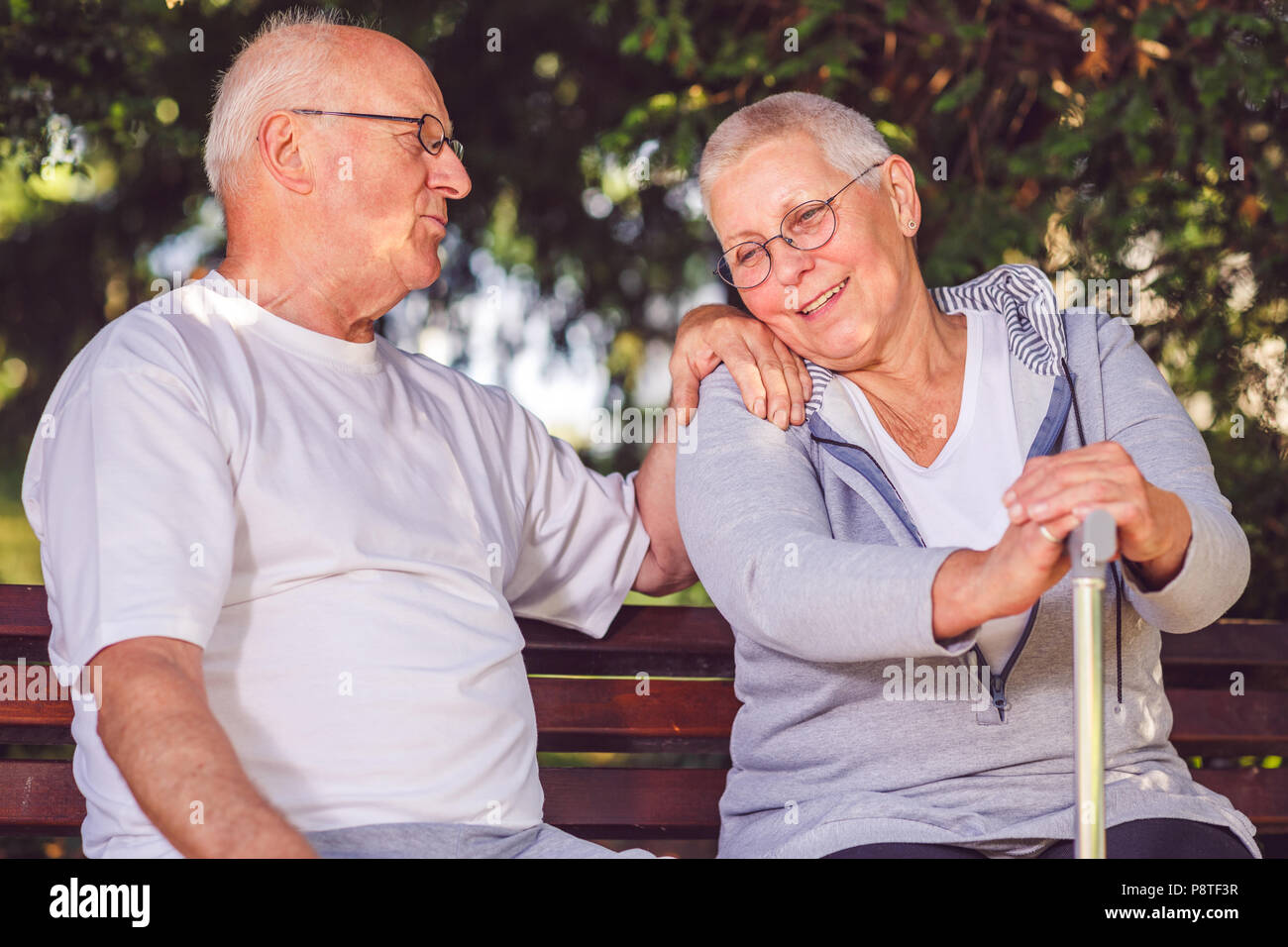 Portrait of happy lovely elderly woman in park Stock Photo