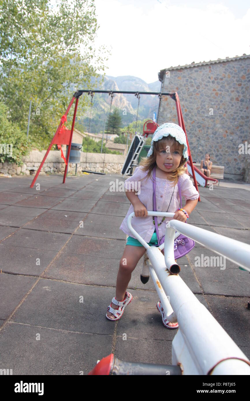 Young girl sticking her tongue out hires stock photography and images