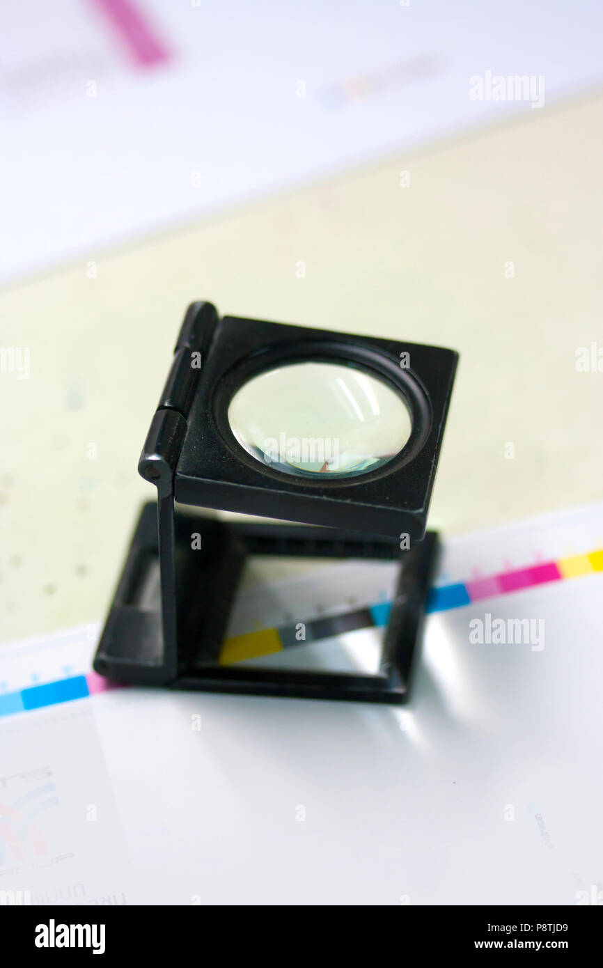 The magnifying glass standing on a leaf of the test print Stock Photo ...