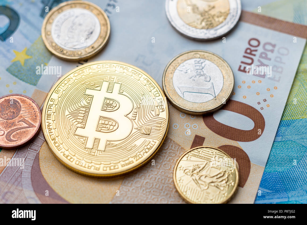 An Bitcoin physical coin sitting on a computer motherboard with a fan and  RAM. Green Light covers the scene. Using the public domain logo Stock Photo  - Alamy