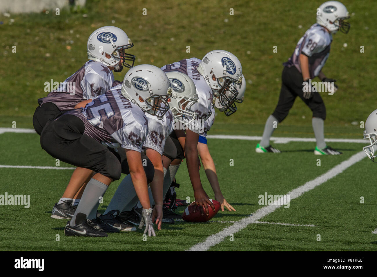 Dramatic, colorful action photo's of Boys Bantam football in Calgary