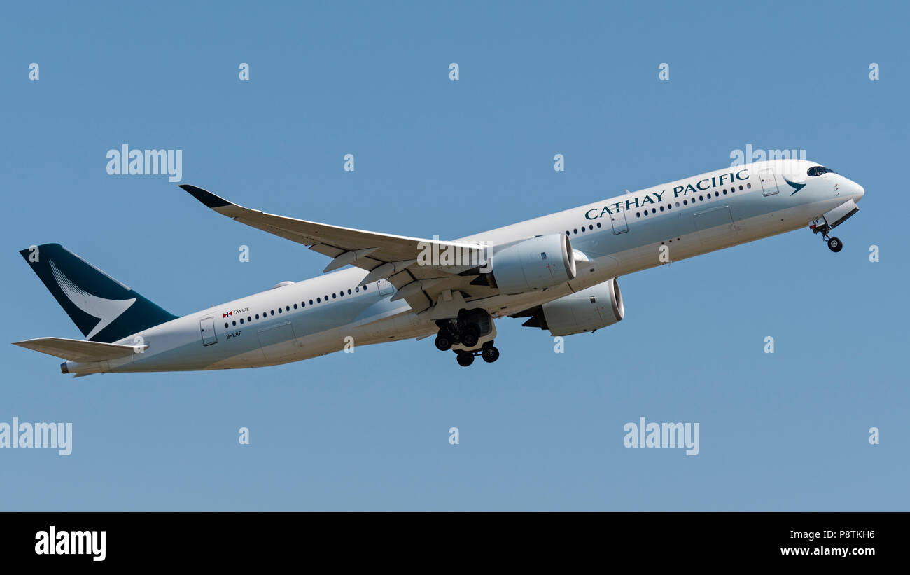 Cathay Pacific Airways plane Airbus A350 extra wide body jet airliner airborne Stock Photo