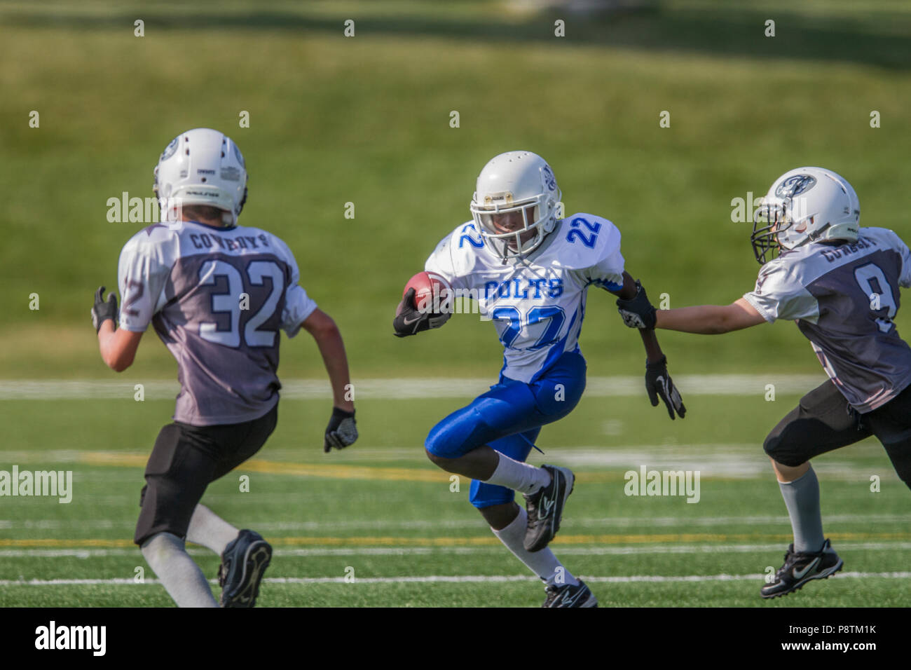 Dramatic, colorful action photo's of Boys Bantam football in Calgary
