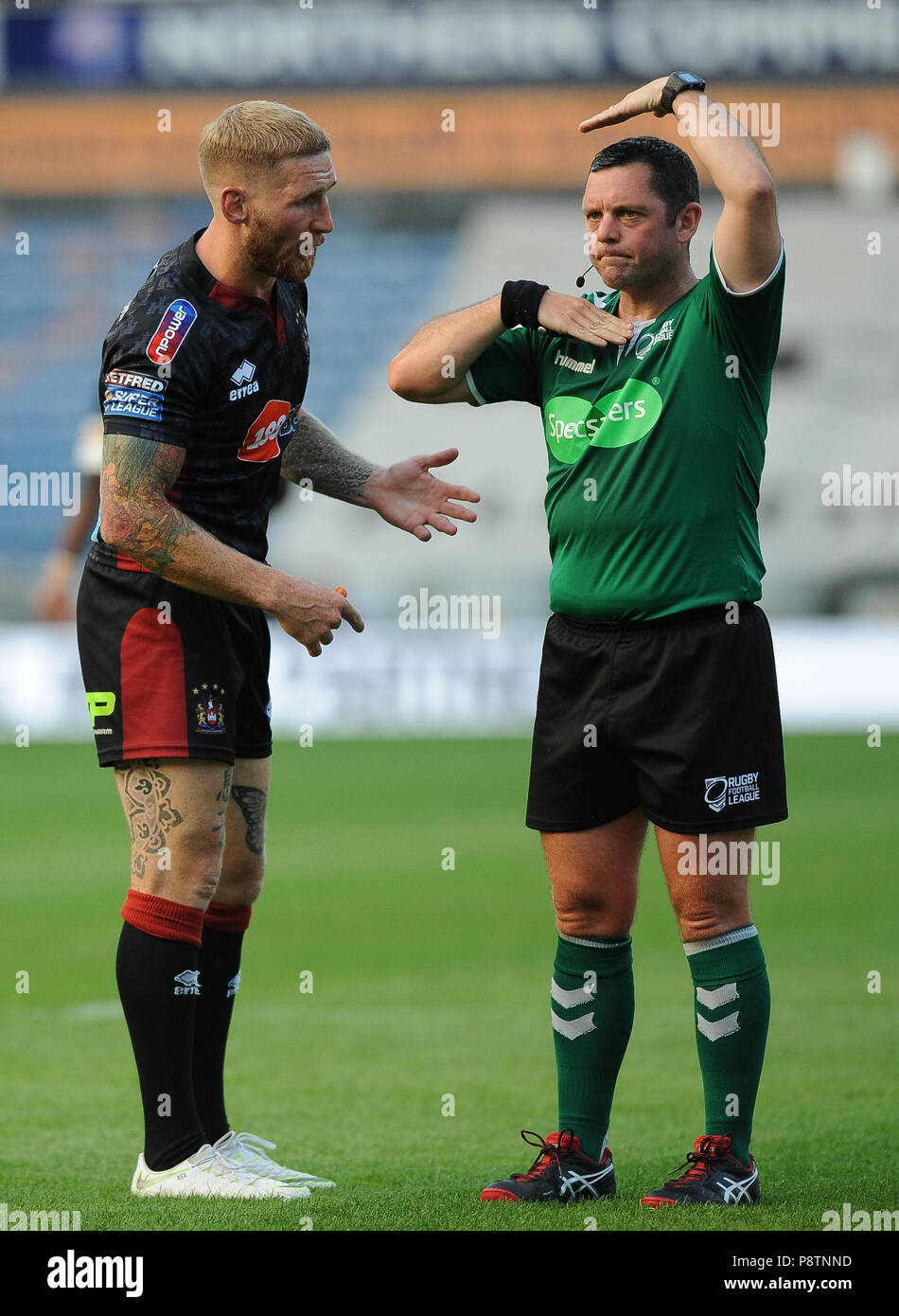 John Smiths Stadium, Huddersfield, UK. 12th July, 2018. Betfred Super League rugby, Huddersfield Giants vs Wigan Warriors; Wigan's Sam Tomkins questions referee Gareth Hewer high tackle decision.  Dean Williams/Alamy Live News Stock Photo