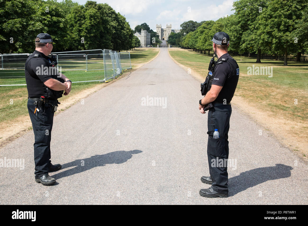 Windsor, UK. 13th July, 2018. Police officers on duty on the Long Walk outside Windsor Castle during the visit of US President Donald Trump to meet the Queen for afternoon tea. A section of the Long Walk was closed to the public. Credit: Mark Kerrison/Alamy Live News Stock Photo