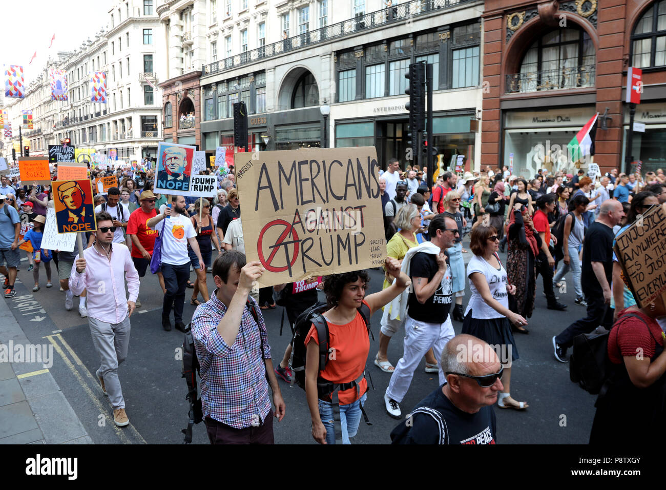 London, UK – July 13, 2018: Demonstrators march down Regent Street in central London to protest against US president Donald Trump, during his visit to the country Credit: Dominic Dudley/Alamy Live News Stock Photo