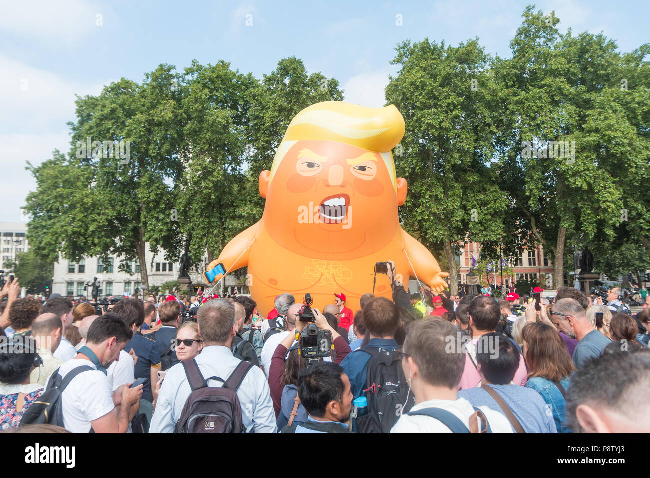 London, UK. 13th July, 2018. Baby Trump blimp floats about Parliament Square Credit: Zefrog/Alamy Live News Stock Photo