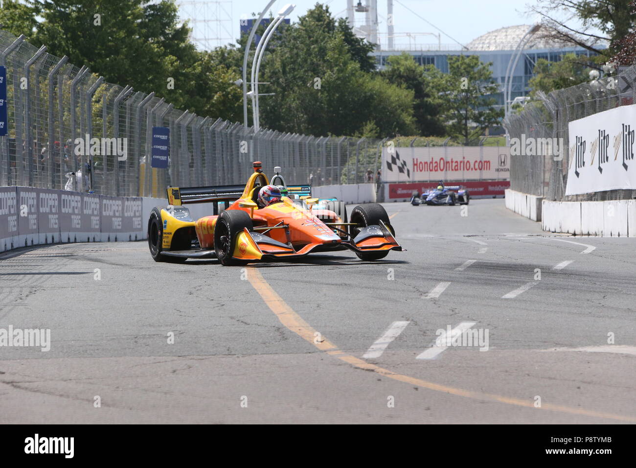 Toronto, Canada. 13th July 2018. The green flag is out as the practice is underway at Honda Indy festivities in Toronto Ontario Canada. Drivers warm up on the streets of Toronto getting ready for tomorrow’s qualifying run and the race on Sunday July 14th. Zach Veach (26) goes into turn 5 during practice. Luke Durda/Alamy Live News Stock Photo