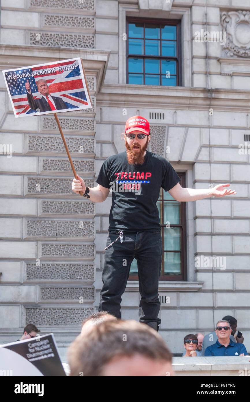 London, UK. 13th July, 2018. Trump supporter observes protest against Donald Trump's visit Credit: Zefrog/Alamy Live News Stock Photo